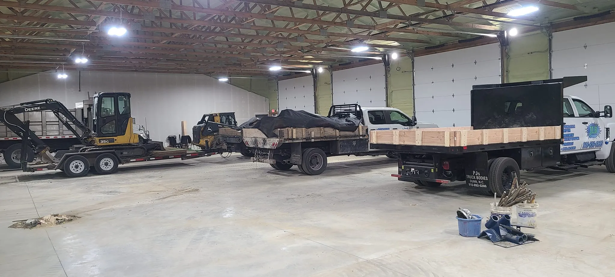 JLB warehouse interior with rows of foundation repair equipment and supplies