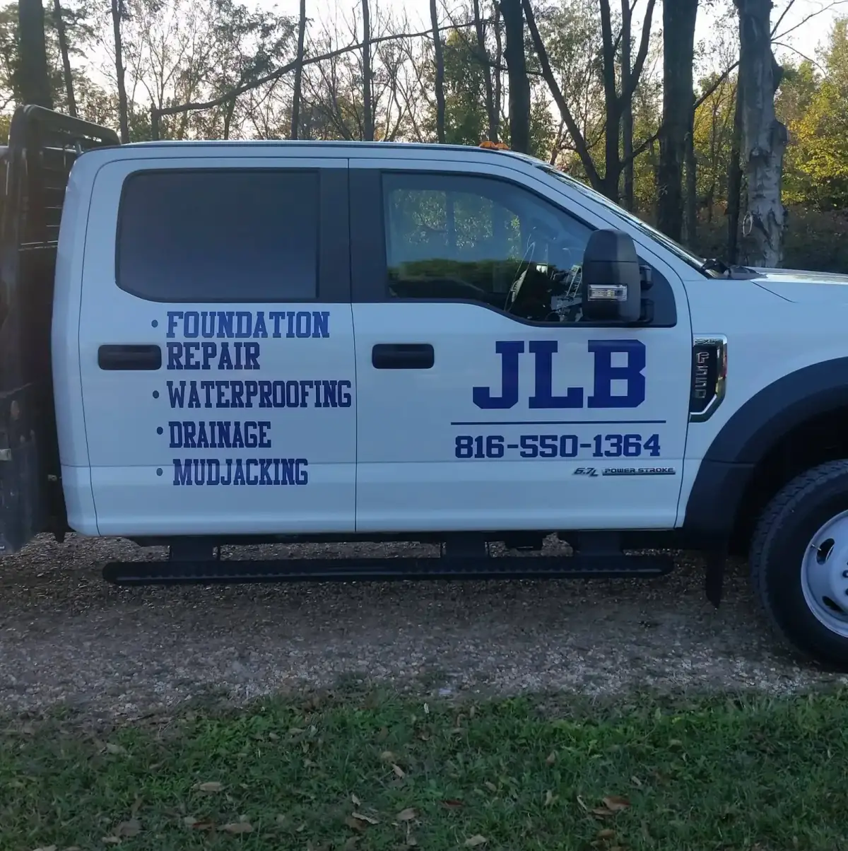 JLB Foundation Repair company truck — angled front view