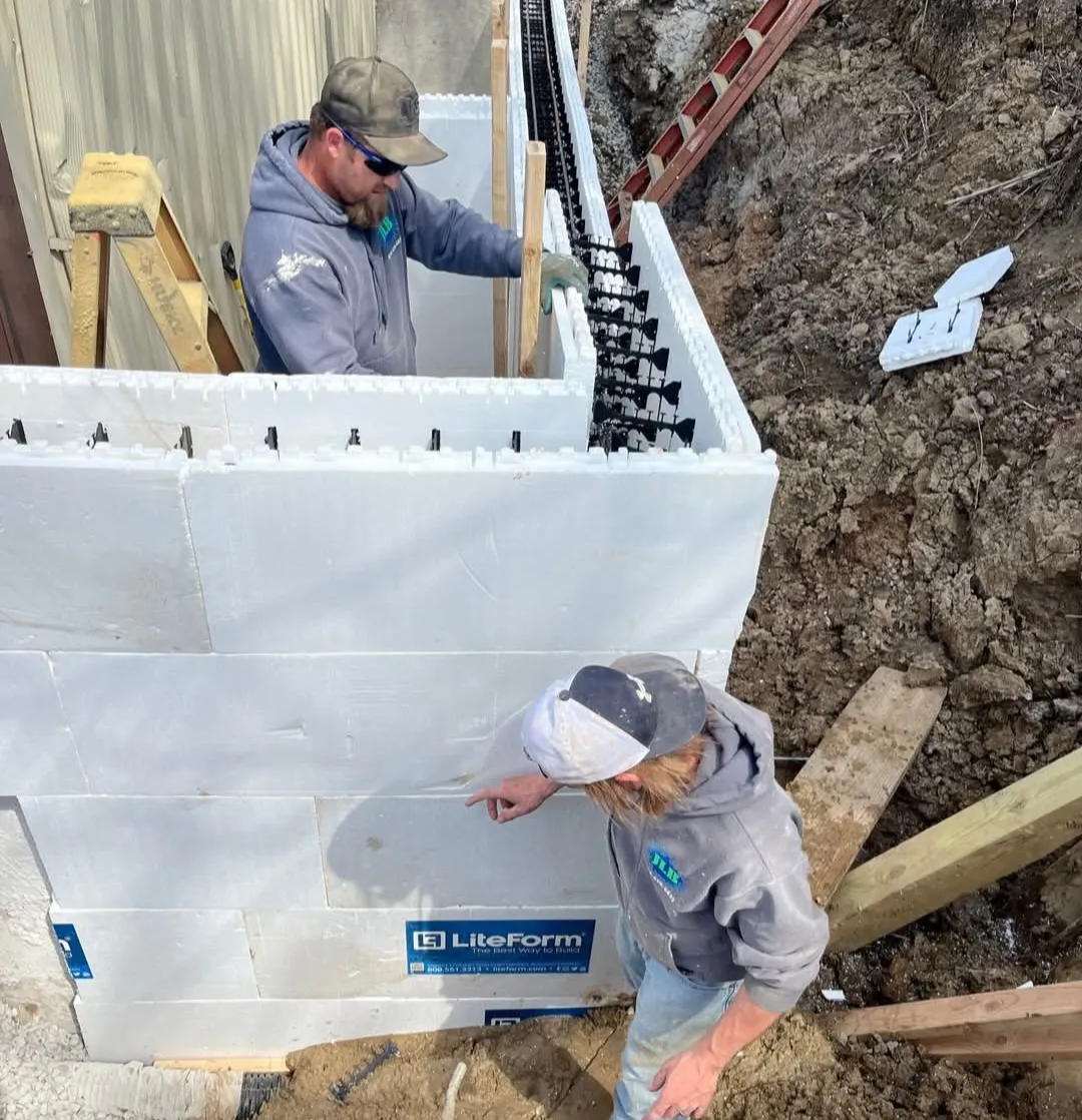 JLB crew members working side by side on foundation in Leawood, KS