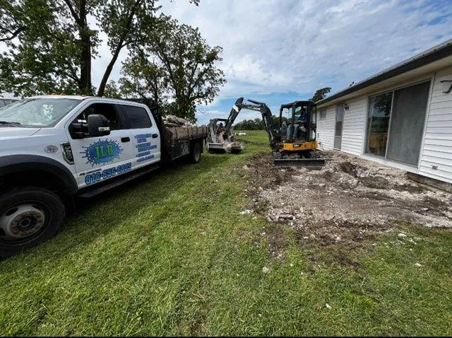 JLB truck and crew excavating at a foundation job in Leawood, KS